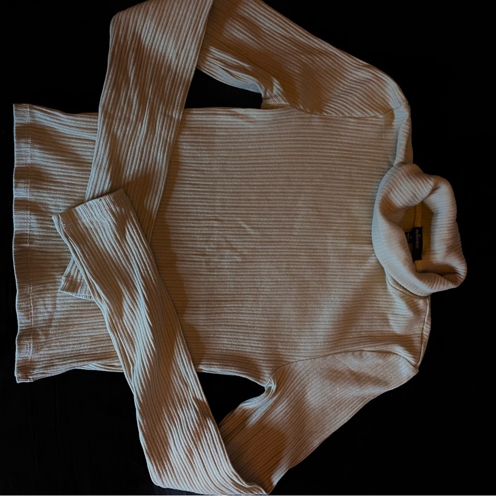 Beige long sleeve turtle neck.